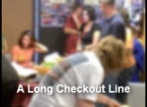 A long checkout line at the end of a long evening of auction and Halloween fun fair activities